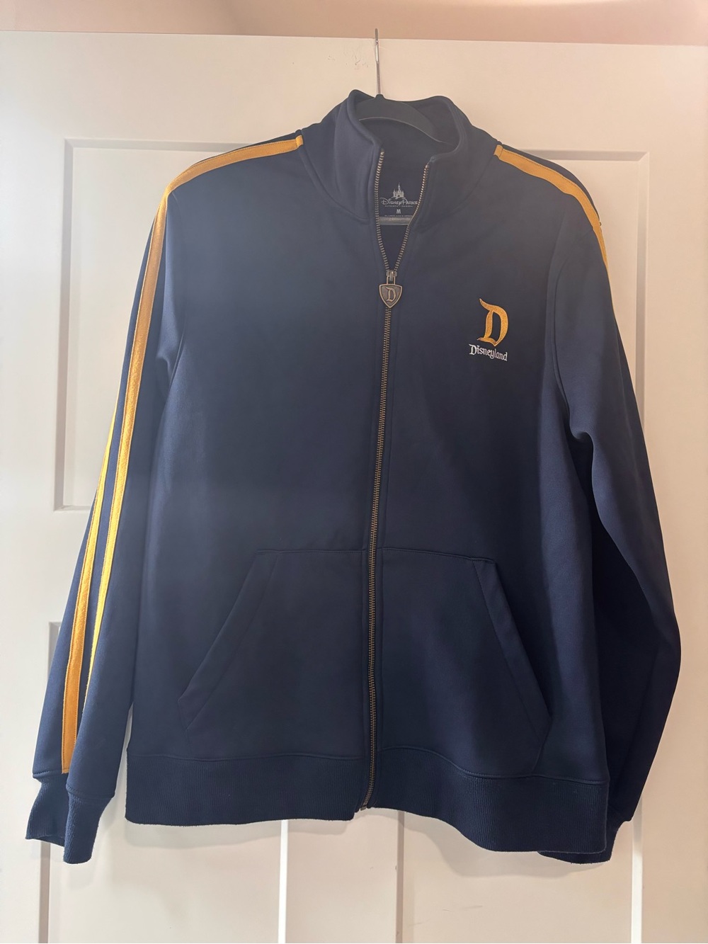 Disneyland Authentic Navy Track Jacket with Yellow Shoulder Stripes